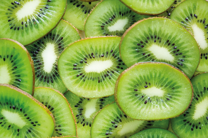 Tischset textur mit frischen kiwi-scheiben - TenStickers