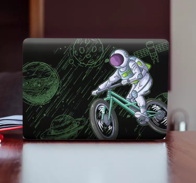 Laptop aufkleber astronaut auf fahrrad - TenStickers